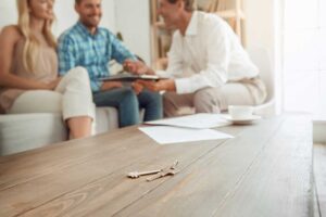 A home inspector examines an attic with a flashlight and a checklist in a residential house.